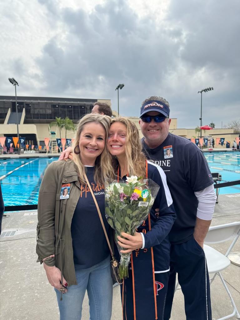 Martin poses for a photo with her parents following Senior Day on Jan. 25, at the Raleigh Runnels Memorial Pool. In her four-year tenure, Martin was the first Wave to be named a CSCAA Scholar All-American and the first Wave since 2012 to be selected to compete at the NCAA Zone Diving competition ('21). Photo courtesy of Lexie Martin